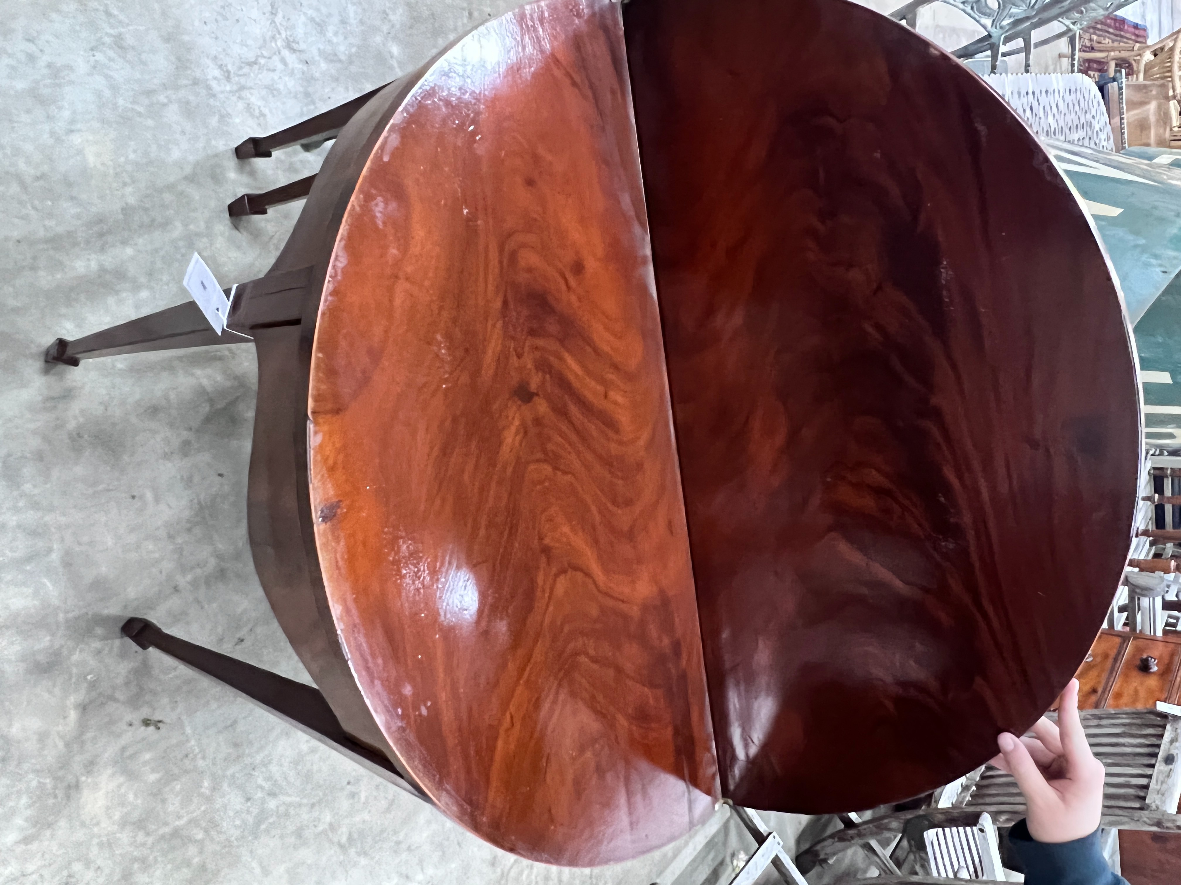 A George III mahogany demi-lune folding tea table, width 92cm, depth 45cm, height 74cm